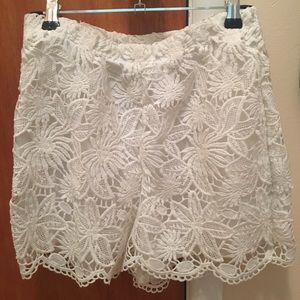 White high waisted shorts with lace detailing